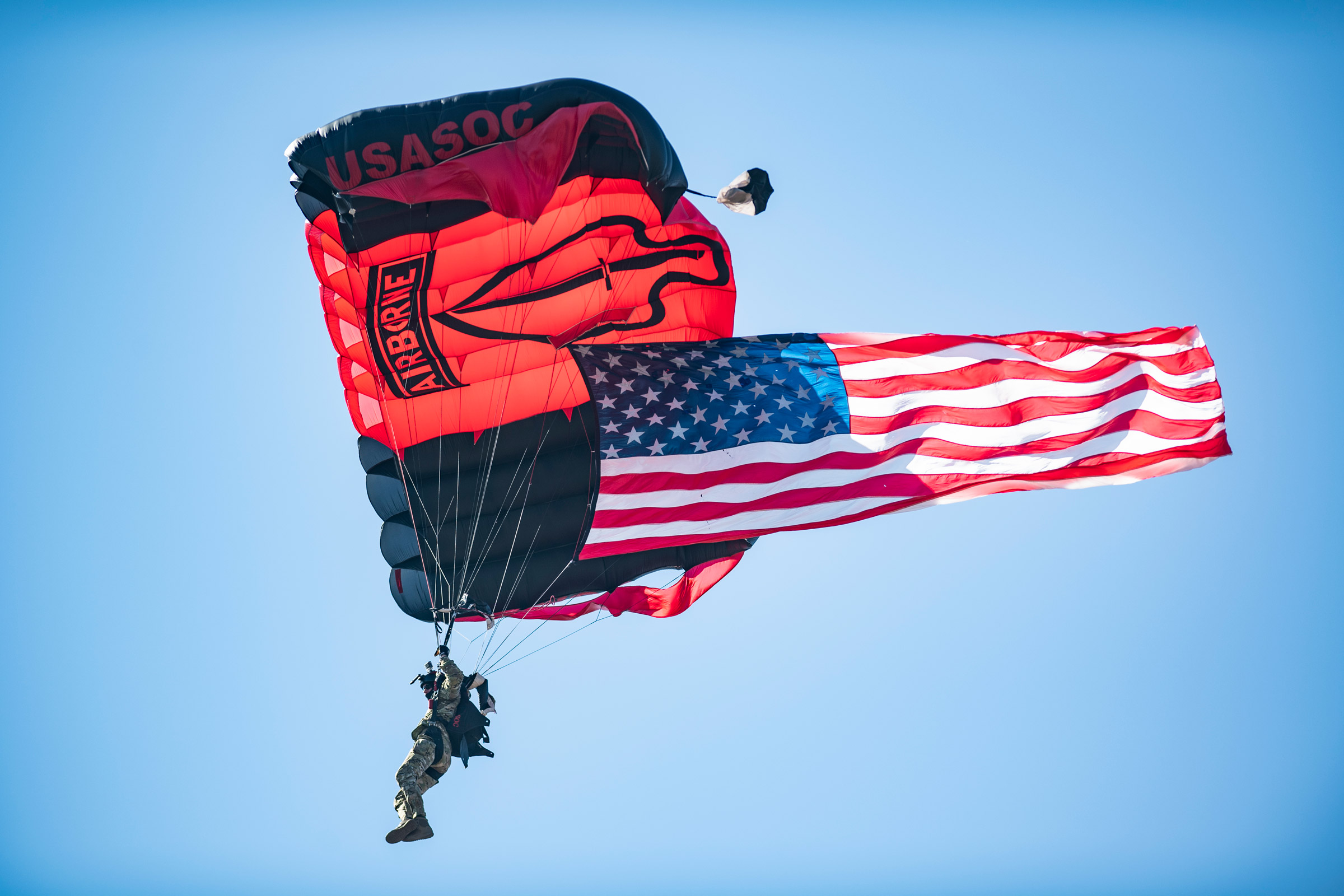 Black Daggers Jump Team parachute in to Davis Wade Stadium to present the game ball.