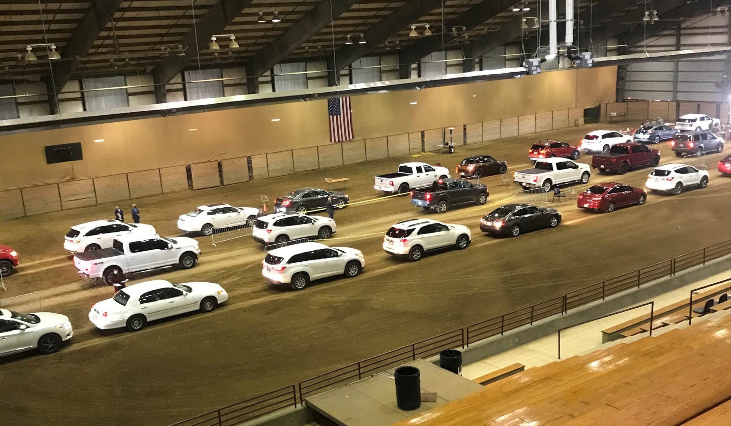 Cars line up for Covid-19 vaccines inside the Horse Park.