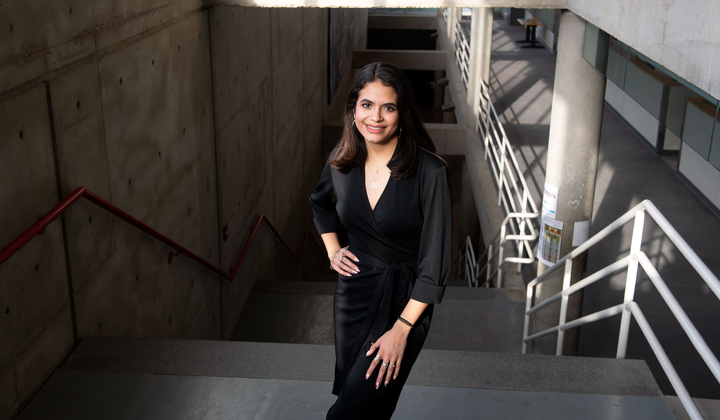 Elisa Castaneda, pictured on the stairs in MSU&#039;s Giles Hall
