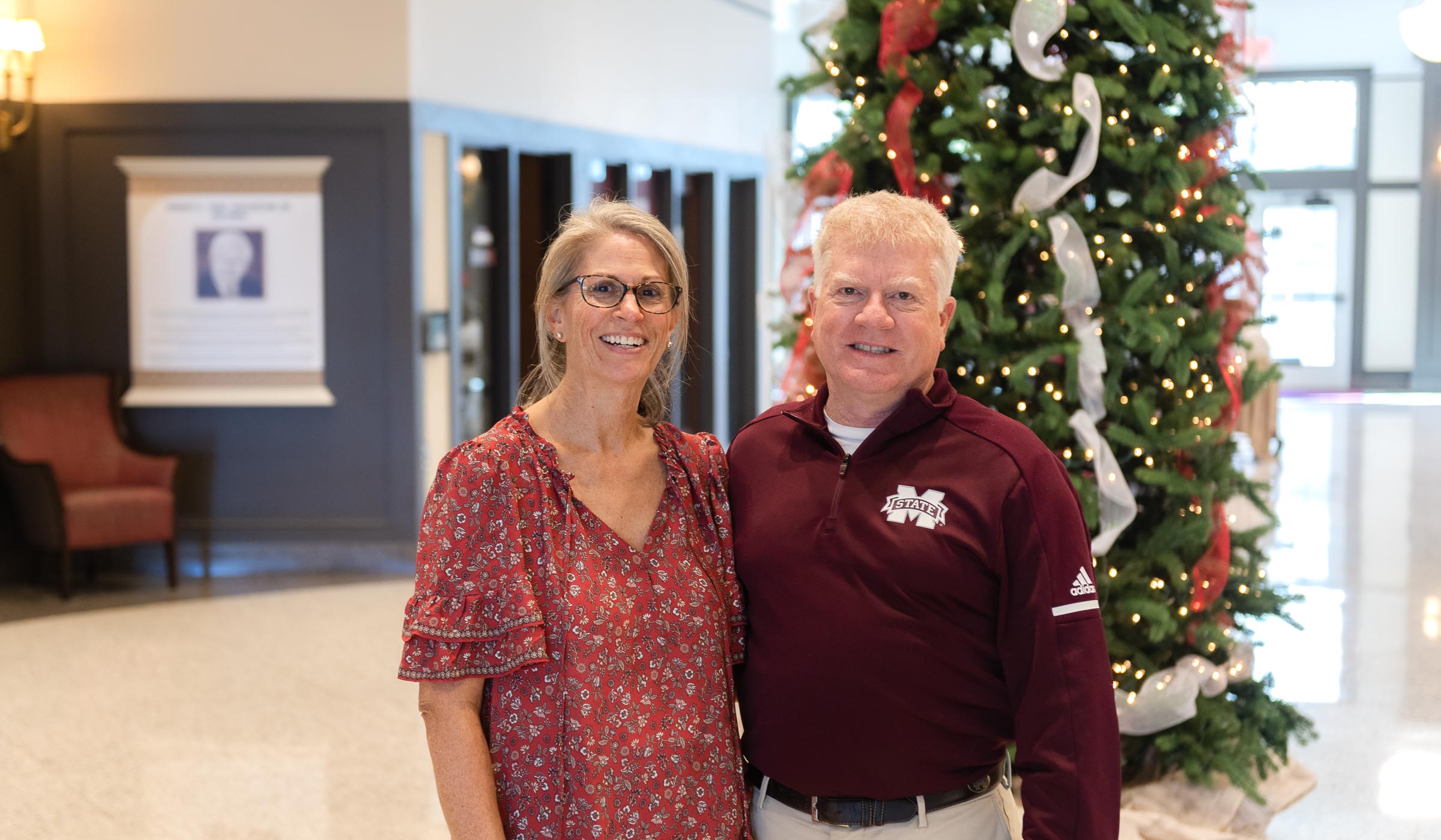 Orly and Jimmy Hardin, pictured in front of a Christmas tree at MSU&#039;s Old Main Academic Center