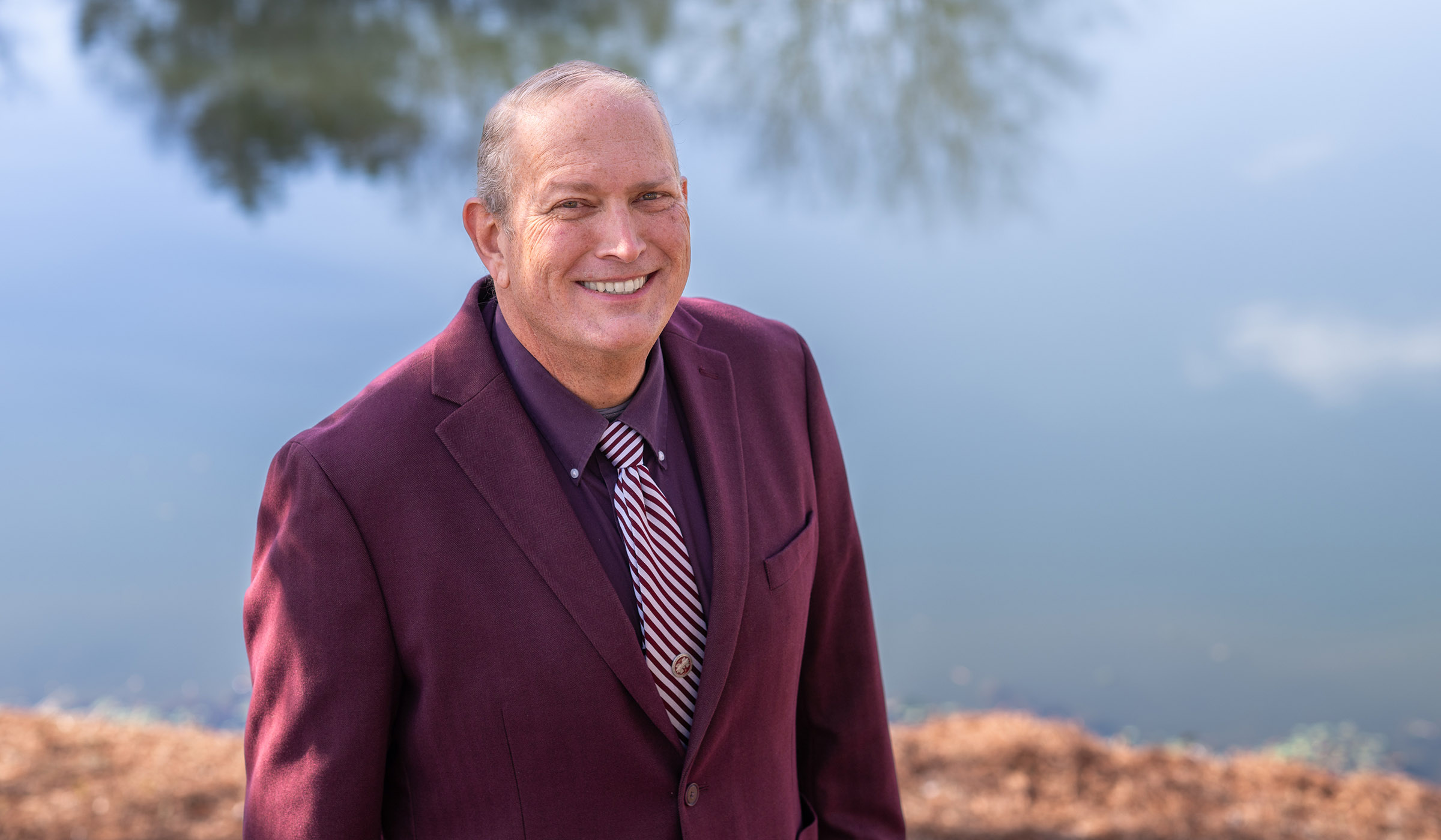 Jonathan Harris, pictured in front of a pond on the MSU campus