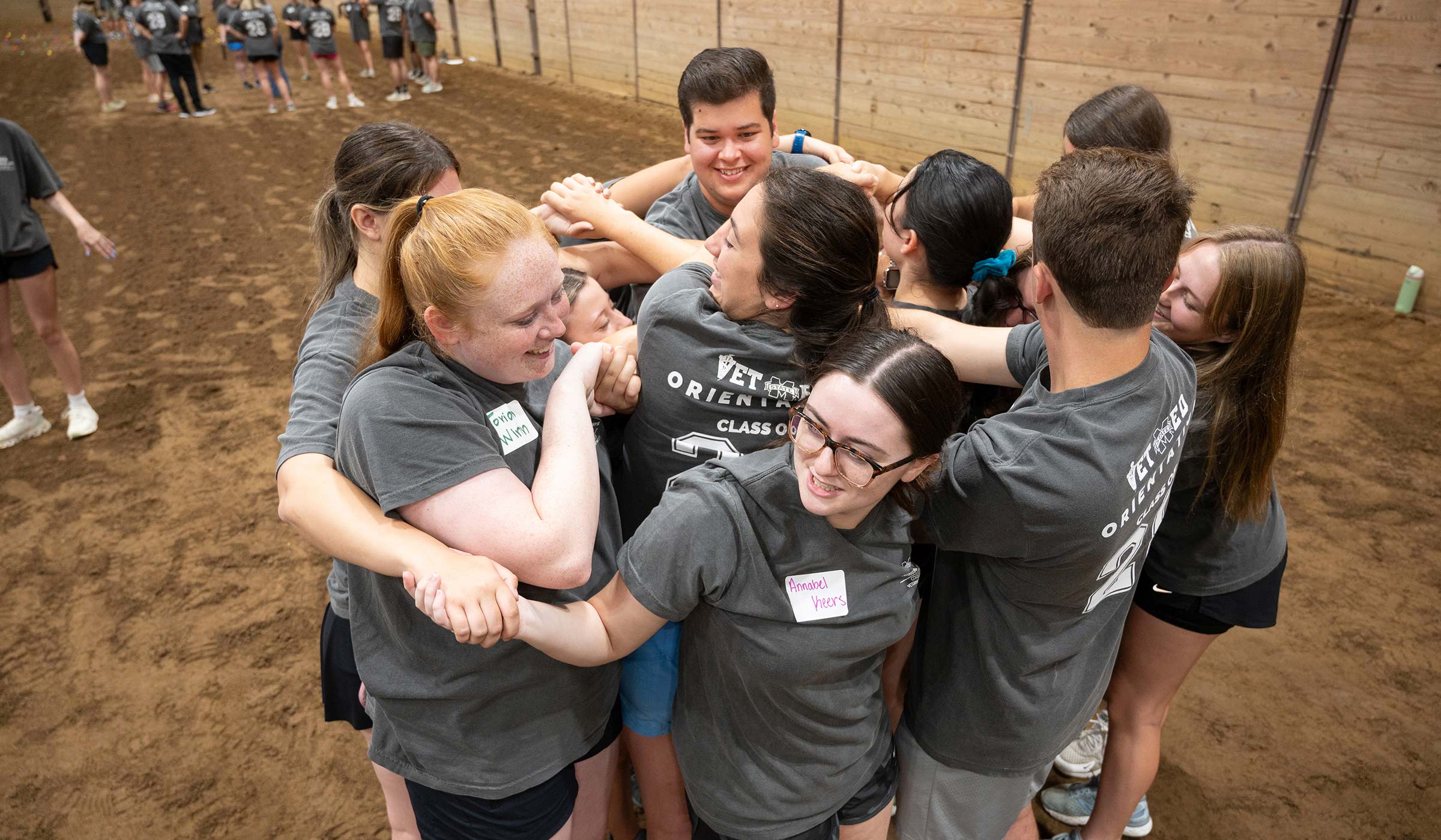 Several first-year students in MSU’s College of Veterinary Medicine work to complete a human knot activity to help build communication skills during Class of 2028 Orientation last week. 