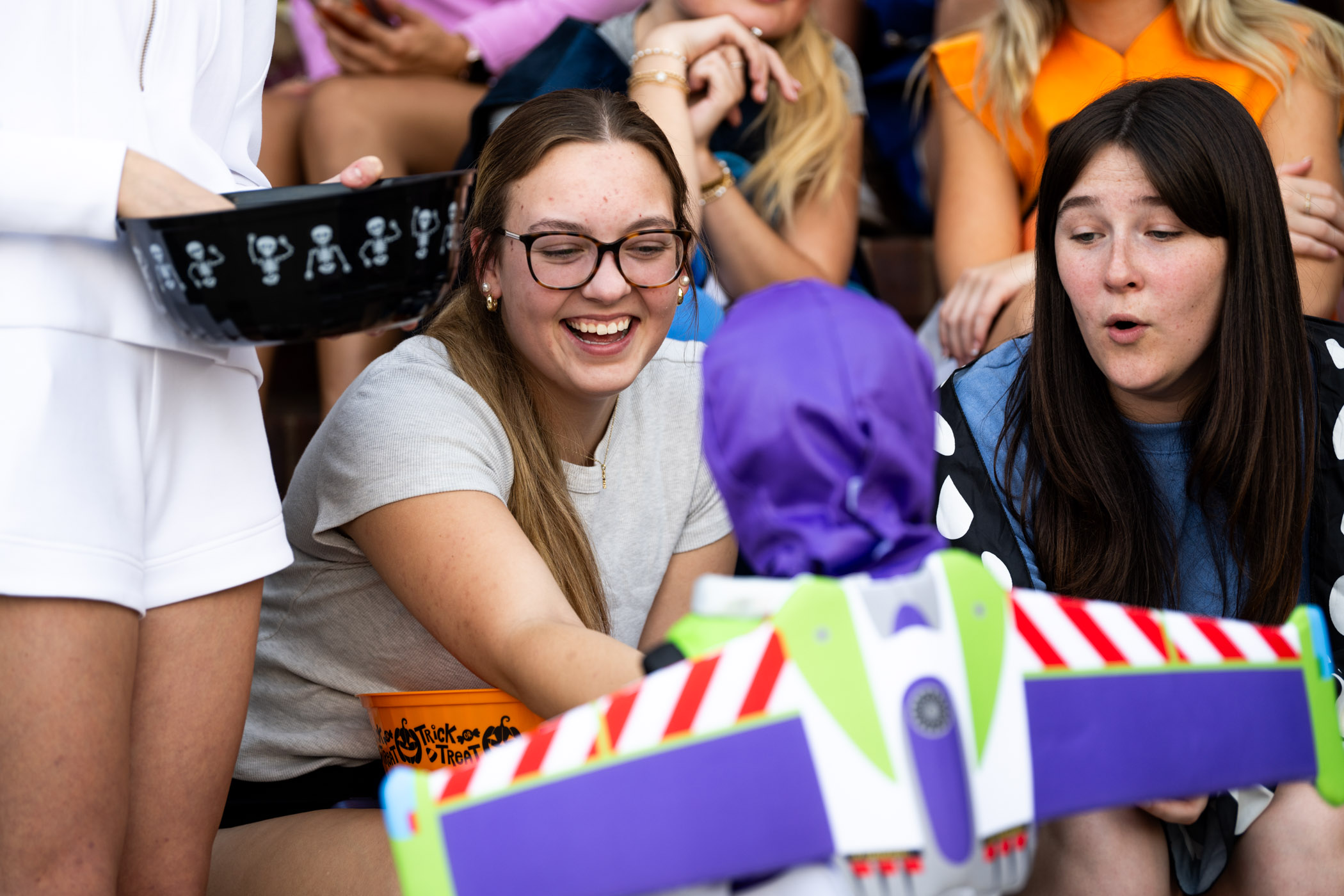Members of the Delta Delta Delta sorority interact with young trick-or-treaters during MSU's annual Trick-or-Treat on the Row