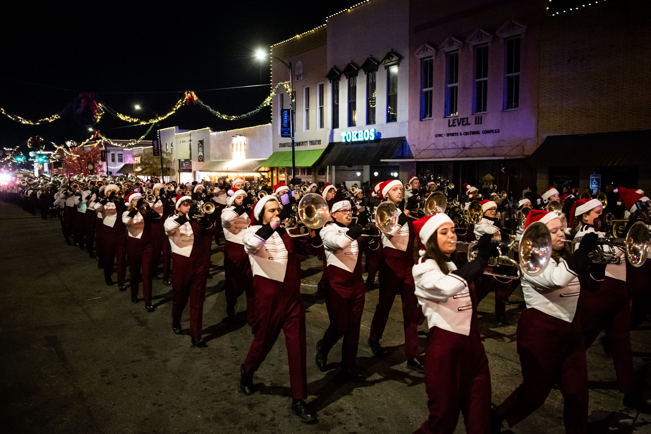 MSU's Famous Maroon Band marches along Main Street, spreading holiday cheer at the city's annual downtown Christmas Parade. The festivities featured decorated floats from local businesses, first responders, community organizations, and even an appearance from Santa Claus!