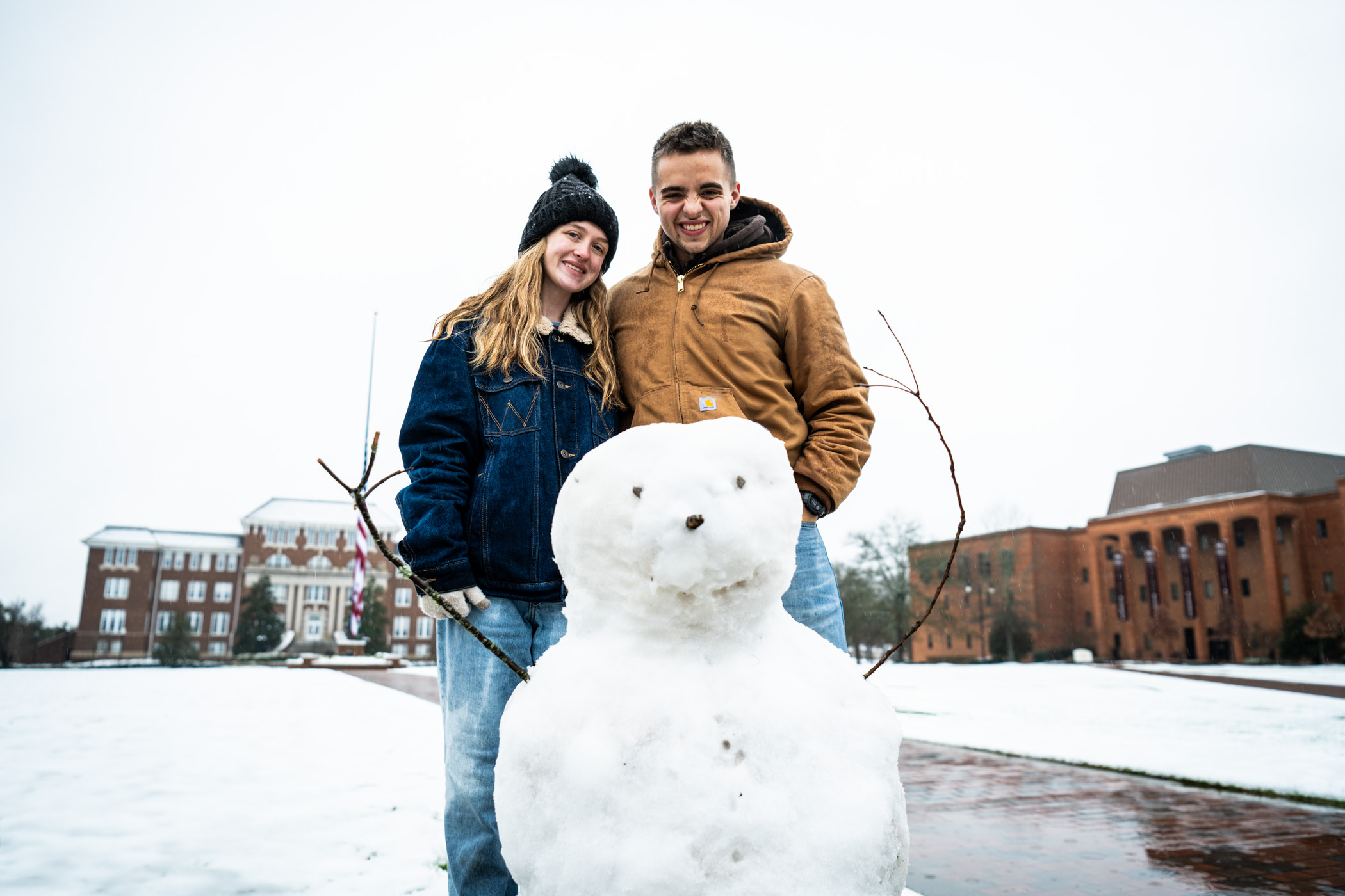Rachel Apperson, a Psychology student from Meridian and Parker Dickinson, an Animal and Dairy Sciences student from Collinsville smile with their completed snow day project: a snowman named "Harold." Rachel and Parker were among many MSU community members out enjoying the rare Mississippi winter wonderland.