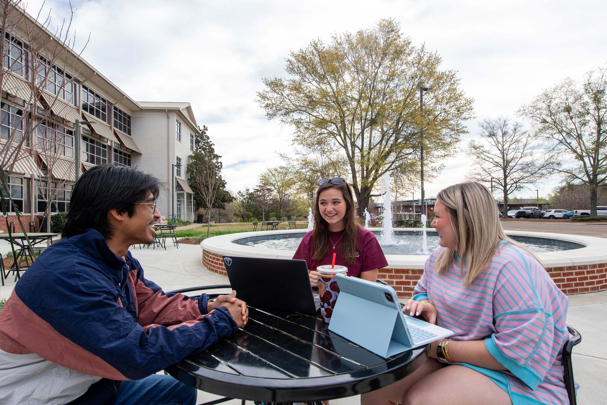 Students enjoy each other's company next to Hilbun Hall's new fountain.