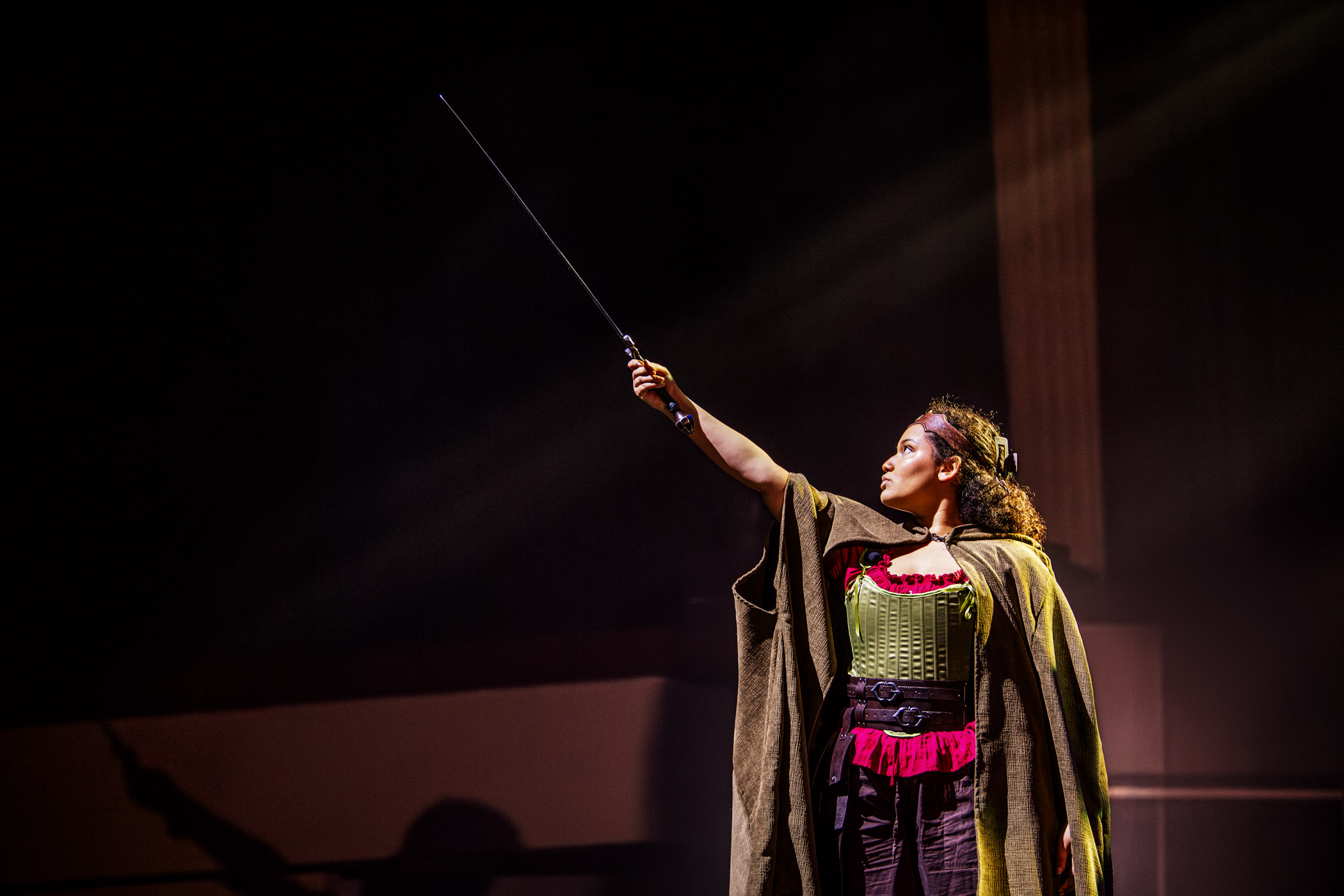 Alicia Young, a freshman Interdisciplinary Studies major from Gulfport, raises her sword as Tillius (Tilly,) the Paladin in MSU Theatre's fantastical production of She Kills Monsters. Created by Qui Nguyen, this Dungeons & Dragons-inspired show invites audiences on an action-packed and heartfelt journey through grief, identity, and geek culture—running April 23–27 in McComas Hall Theatre.