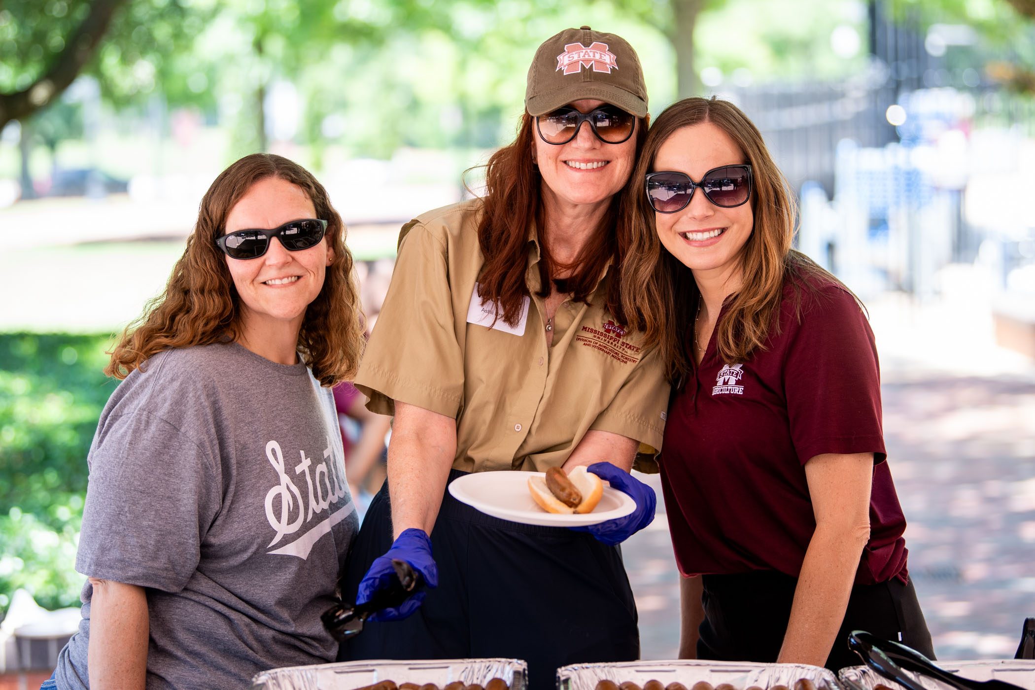 Jessica Rahim (left), Dr. Ashli Brown (middle), and Mary Kathryn Kight (right,) generously volunteer their time to serve fellow Bulldog staff members during Staff Appreciation Day [May 23.] Held annually in the Junction, this spirited event is the university’s way of saying thank you—offering free food, Starkvegas Snowballs, yard games, karaoke, and exciting door prizes. The afternoon also honors the outstanding dedication and service of the recipients of this year’s Donald W. Zacharias Distinguished Staff 