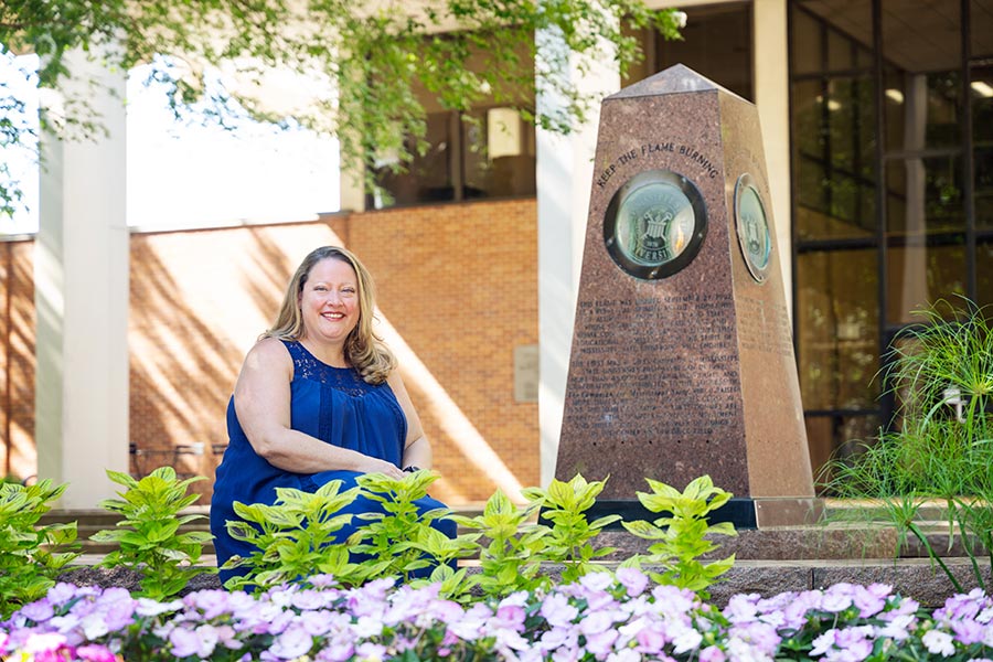 Abigail Voller in front of garden