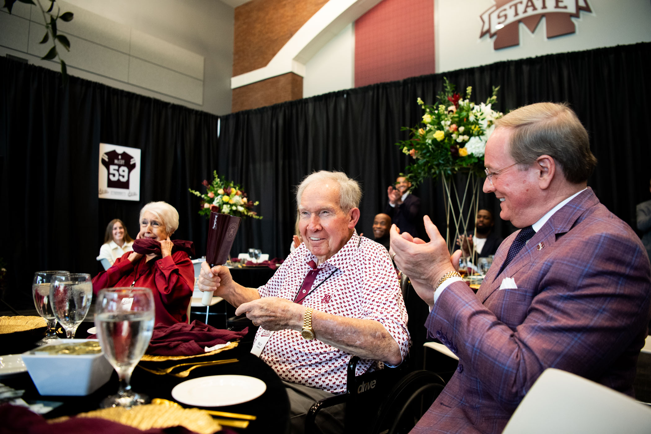 Mississippi State alumnus and longtime university supporter Billy W. Howard Sr. rings a cowbell Monday [June 16] during a special event recognizing Howard Industries' financial support of a 110,000-square-foot indoor football practice facility. The event honored Howard’s enduring legacy as a multi-sport athlete and his pivotal role in advancing the future of Bulldog athletics through this transformative investment.