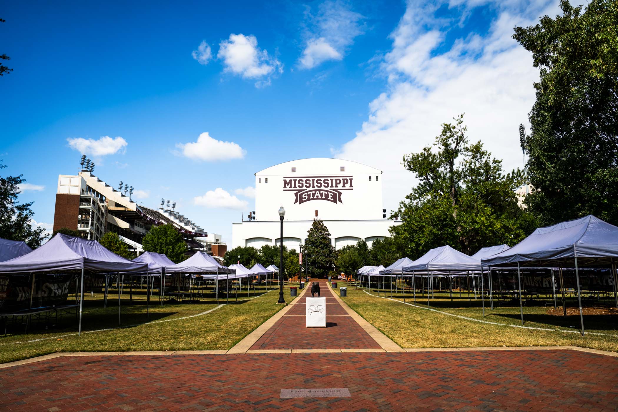 Rows of tents stretch across the Junction as campus prepares for another Saturday in Starkvegas, where fans and alumni gather to celebrate Bulldog traditions before a conference clash against the Tennessee Volunteers. The matchup marks Mississippi State’s SEC opener, with kickoff set for 6:30 p.m. inside Davis Wade Stadium. For gameday details—including parking, tailgating guidelines, and stadium information—visit hailstate.com/gameday.