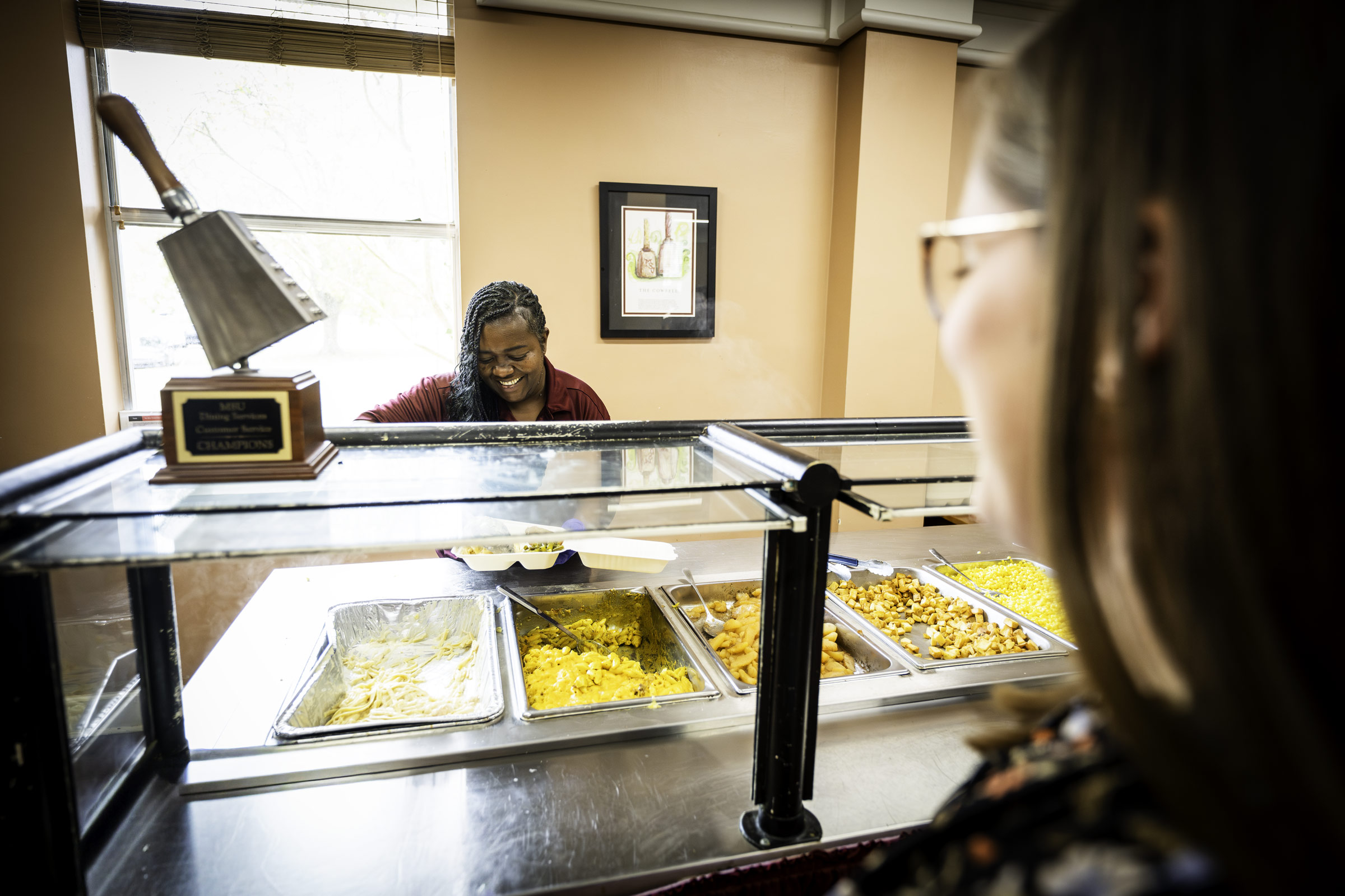 MSU Dining Services employee Christian McCurry prepares a plate Thursday [Nov 20] during one of the final lunch rushes at McArthur Cafe before the eatery undergoes renovations. The café, located in McArthur Hall, is closing for updates beginning Monday [Nov. 24]. The project is scheduled for completion in August, bringing comfort food back to campus in time for the start of the fall semester.