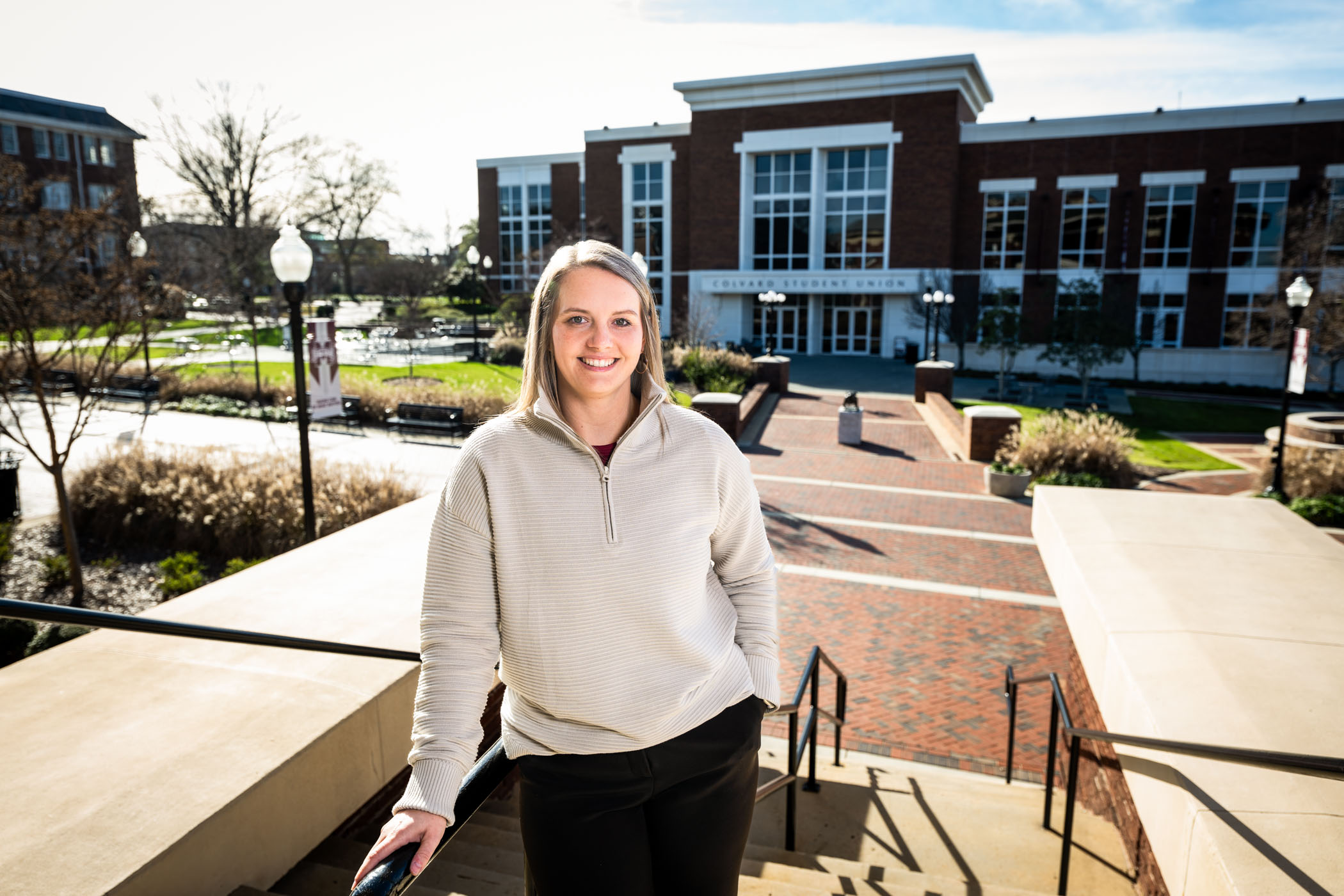Mikela Barlow at the YMCA Building with the Union in the background