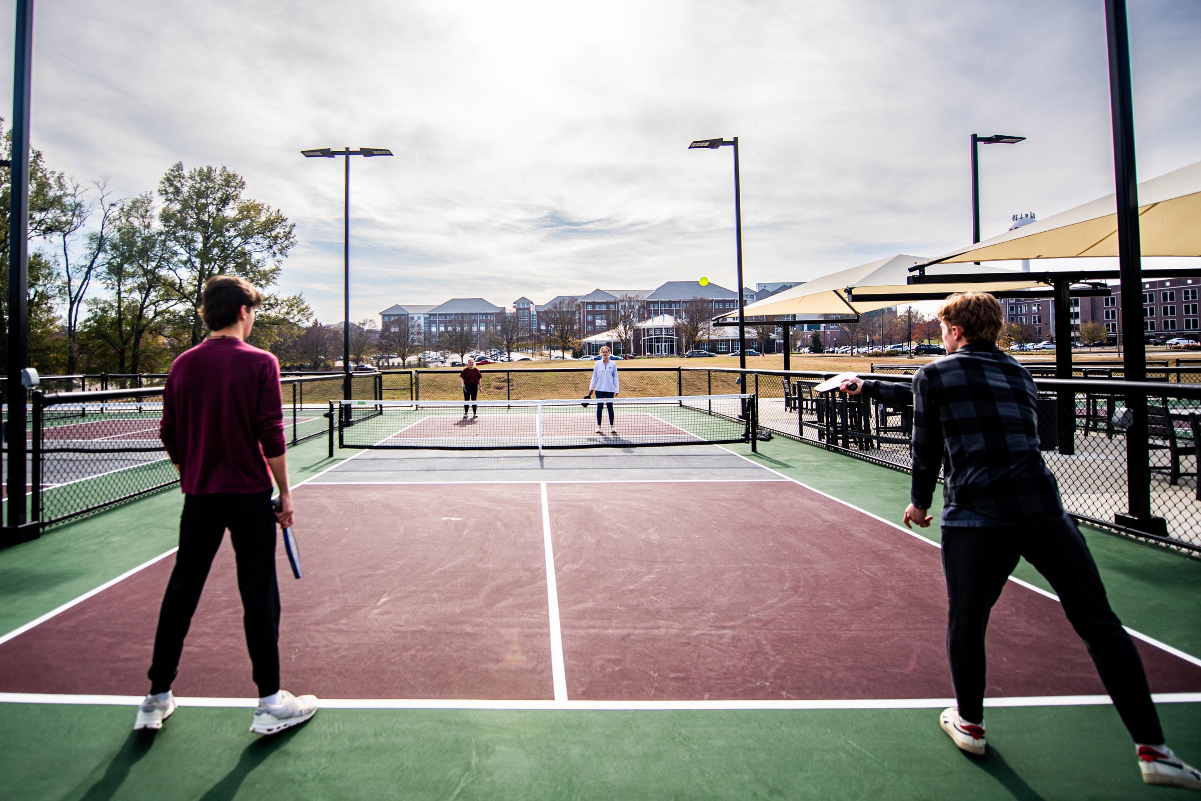 A group of students enjoys a break from their day to play a round of doubles at Sanderson Center's newest addition-- MSU's pickleball courts [Jan 16]. The courts offer an inviting space for students to stay active, soak up fresh air, and take part in one of the nation's fastest-growing sports.