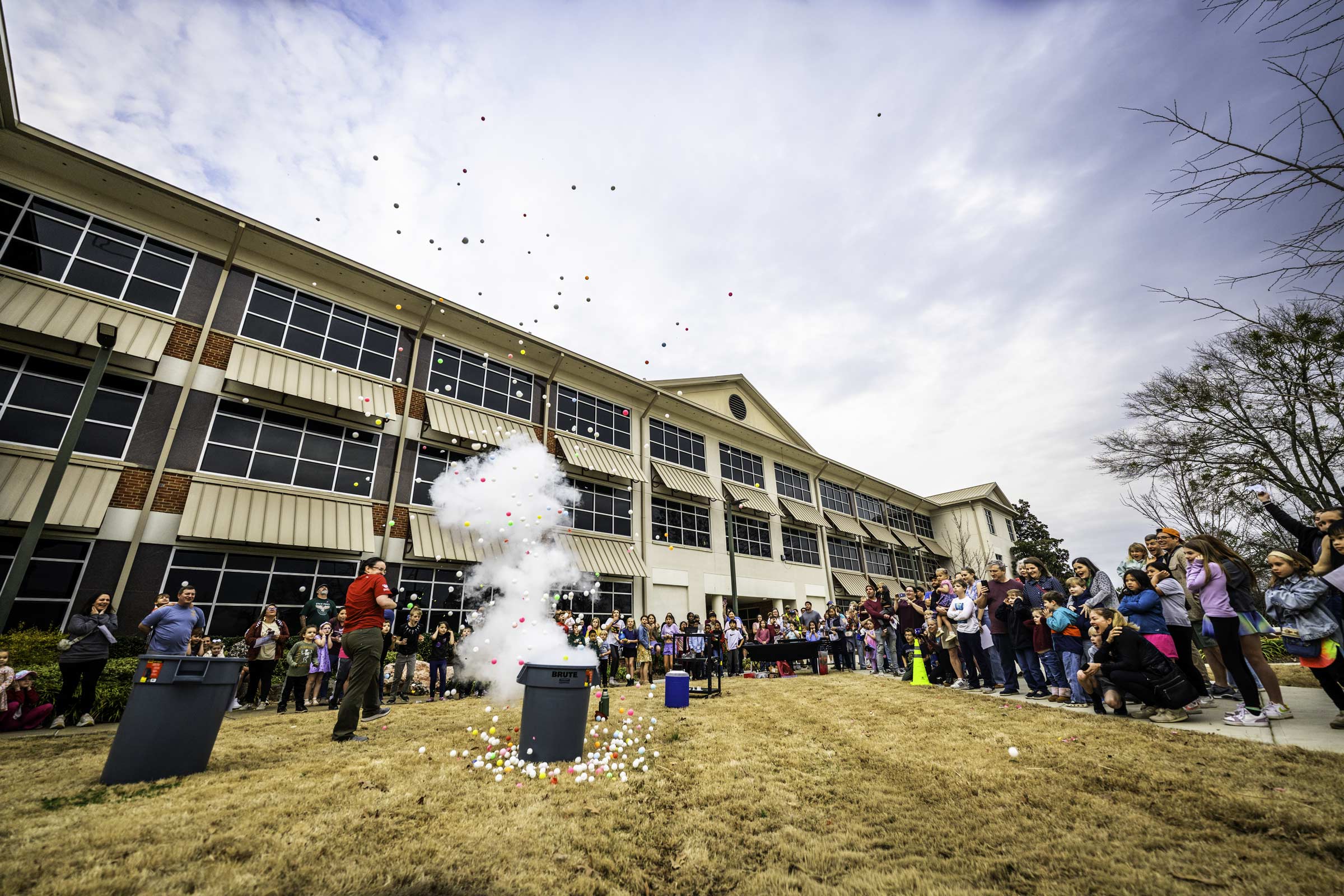 Claire Geneser, (red shirt,) a lecturer in MSU's Department of Physics and Astronomy, showcases the effects of pressure from liquid nitrogen on ping-pong balls during an explosive demonstration at Saturday's [Feb 21] "Science Night at the Museums." The annual event, organized by the MSU Museums and Galleries Committee, took place at MSU's Hilbun Hall and Cobb Institute of Archeology and offered participants of all ages the opportunity to enjoy hands-on scientific activities related to entomology, astronomy,