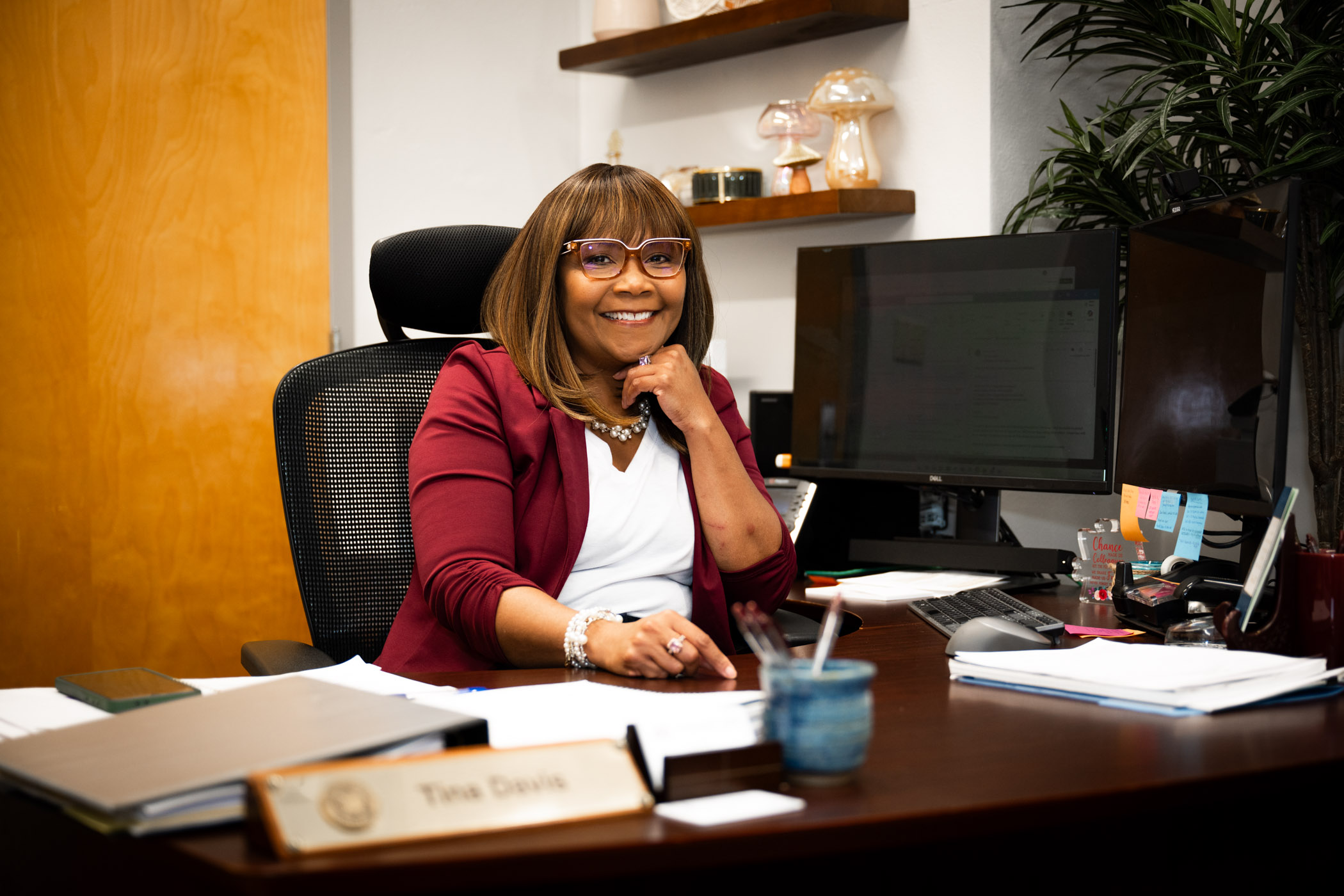 Tina Davis sitting at her work desk