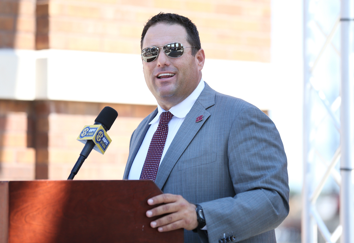 New Baseball Coach Chris Lemonis speaks at the podium at the press conference.