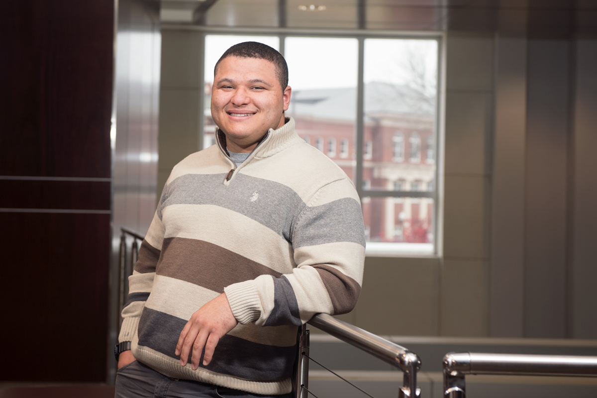 Ephraim Ringo, pictured leaning on a second-floor railing in Colvard Student Union