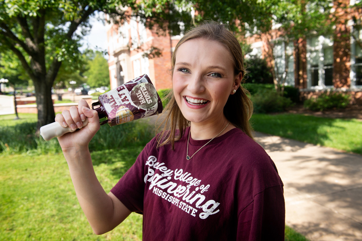 Caroline Bearden, pictured ringing a cowbell on the MSU campus.