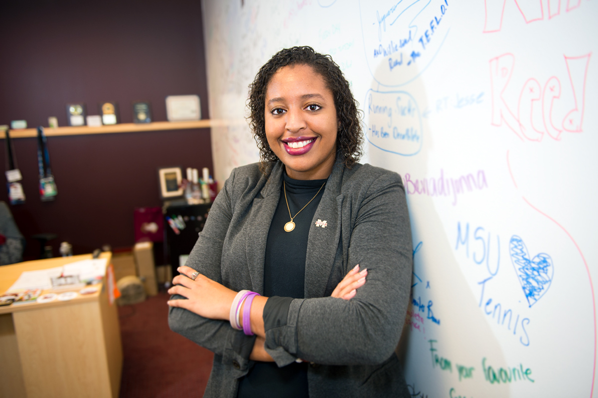 JP Abercrumbie, pictured in an office in front of a whiteboard.