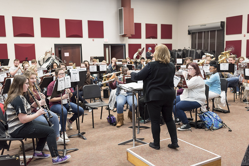 Dr. Nola Jones rehearses with band