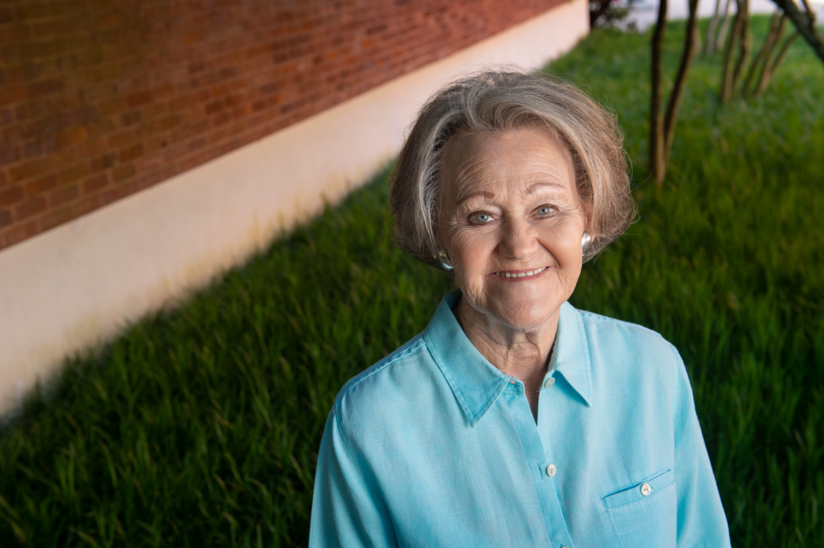 Jeannette Booth is pictured in a grassy area near Simrall Electrical Engineering Building.