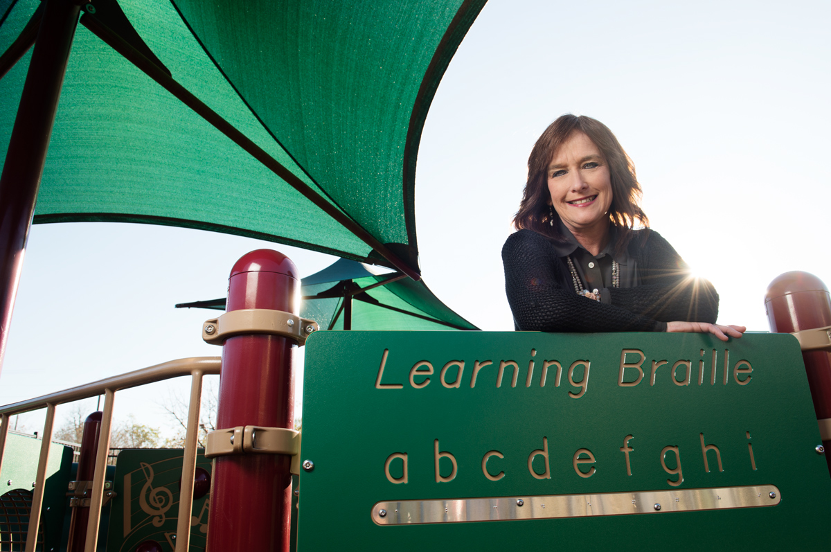 Trish Cunetto, pictured in front of educational playground equipment.