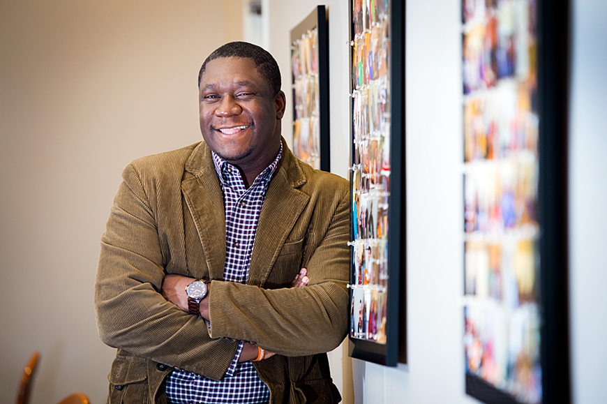 Jermaine Jackson, photographed standing against an office wall.