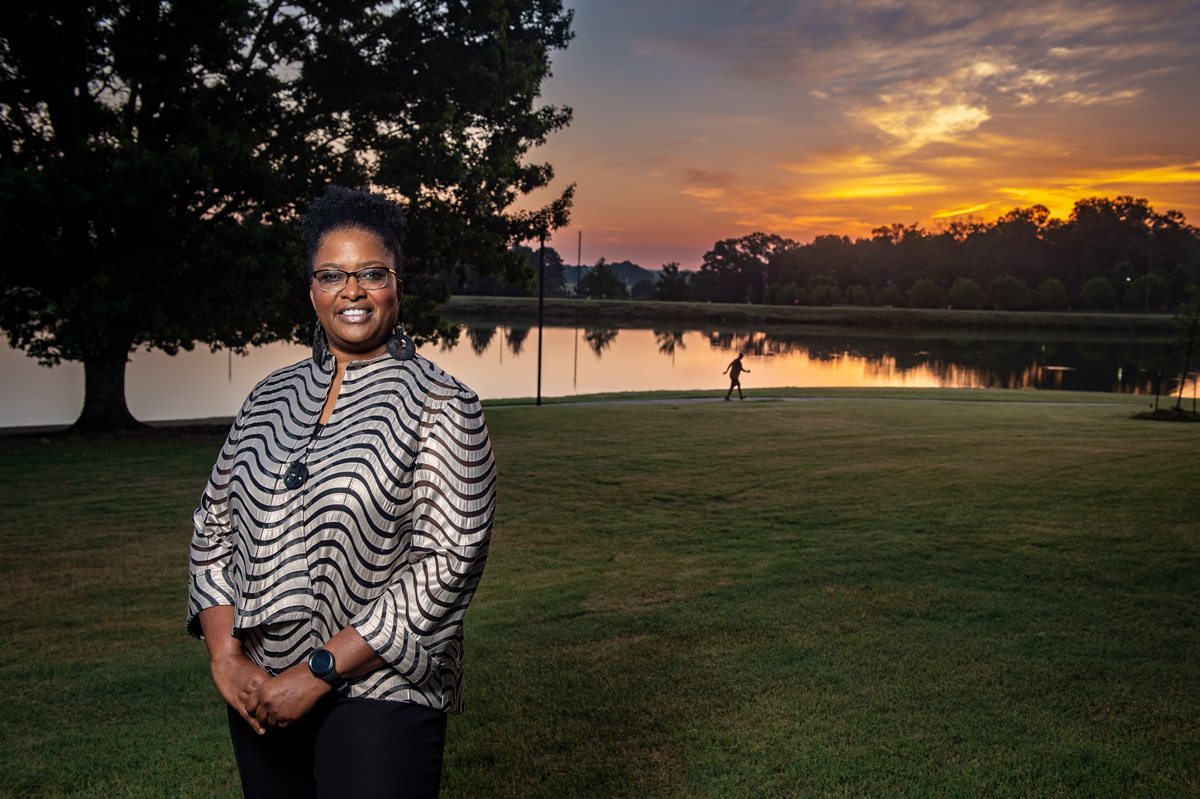 Jennie Griffin, picture in front of a Chadwick Lake sunrise.