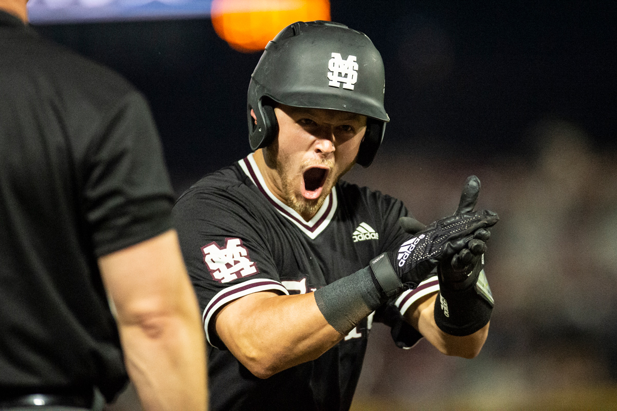 MSU catcher Dustin Skelton celebrates his three-run triple in the third inning Sunday[June 9], giving the Diamond Dawgs the lead