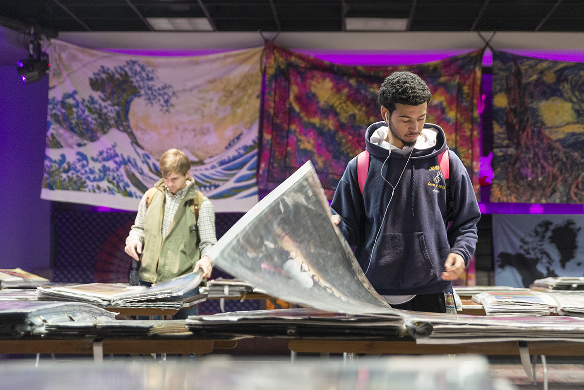 Two students browse books of posters in MSU&amp;#039;s Colvard Student Union.