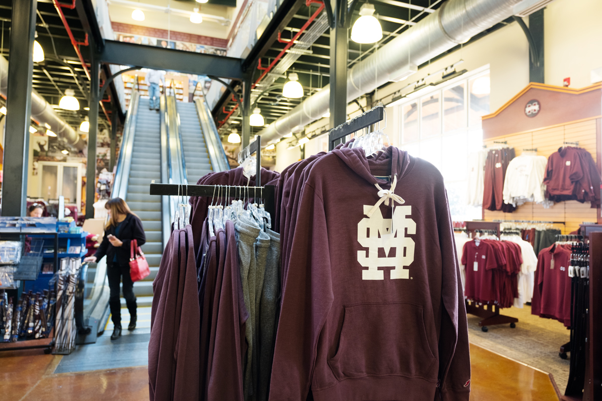 With MSU merchandise in the foreground, Barnes &amp;amp; Noble holiday shoppers descend the escalators in the background.