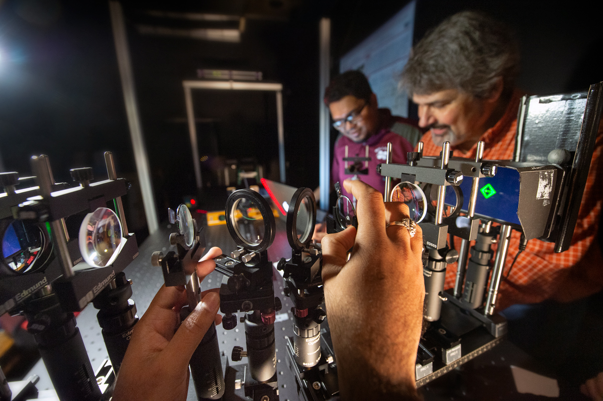 Researchers in the Spatial Perception And Augmented Reality Lab (SPAAR) calibrate their experiment.