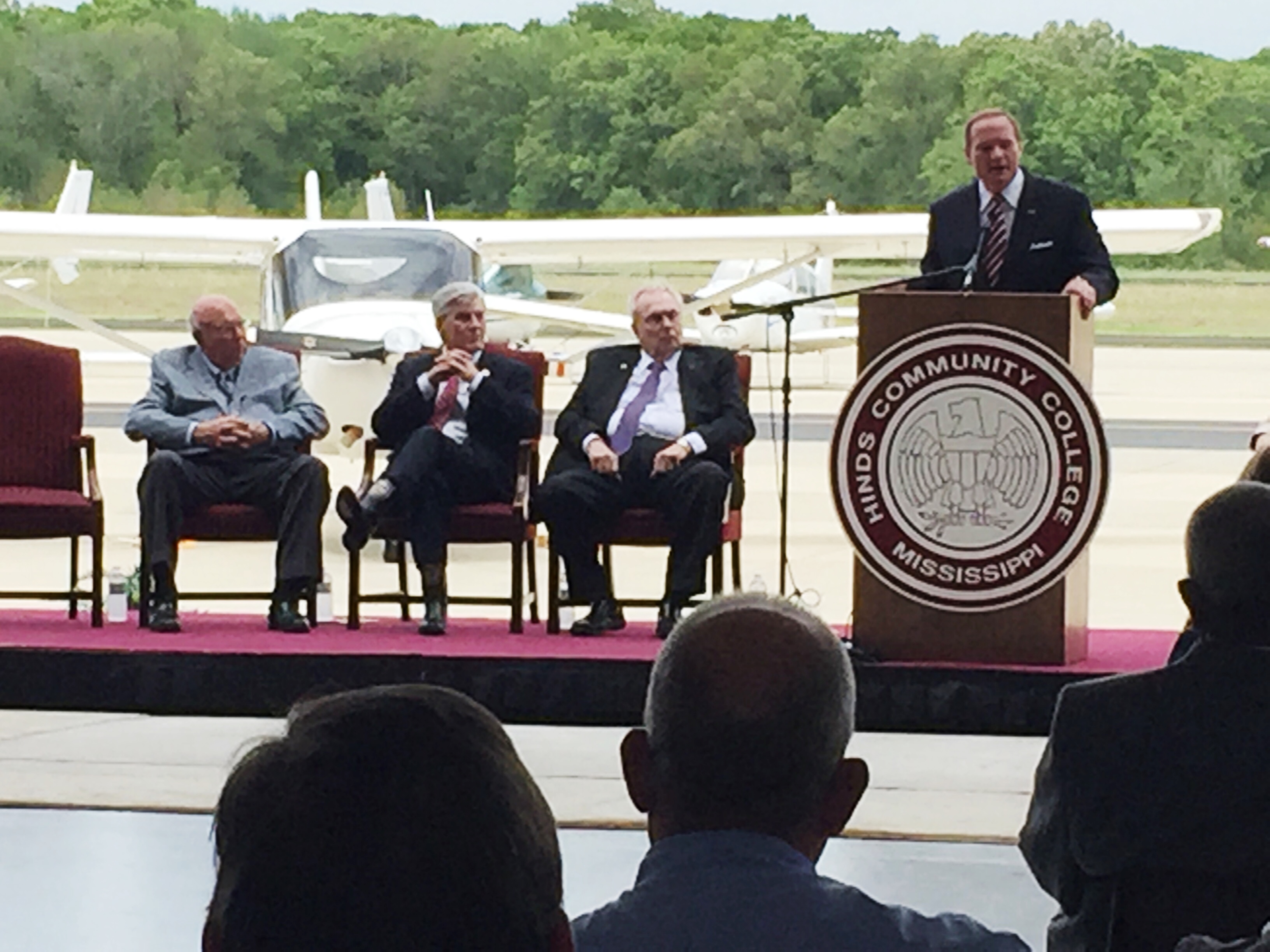 MSU President Mark E. Keenum addresses the crowd at the announcement of the 2 Plus 2 precision agriculture partnership  with Hinds Community College established today [April 9]. Others on the podium applauding the alliance are, from left, Ted Kendall III, longtime HCC Board of Trustees member and owner of Gaddis Farms in Bolton; Governor Phil Bryant; and HCC President Clyde Muse.