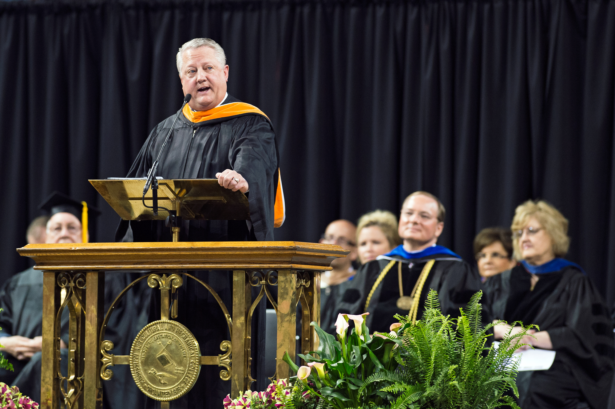 Mississippi State alumnus Tommy Nusz spoke about success in life and business during spring 2015 commencement exercises at Humphrey Coliseum. He shared advice with graduates from his personal experiences and more than 30-year career in the oil industry. The 1982 petroleum engineering graduate now is CEO and chairman of the board of Oasis Petroleum, a $4.5 billion enterprise he helped launch in 2007.