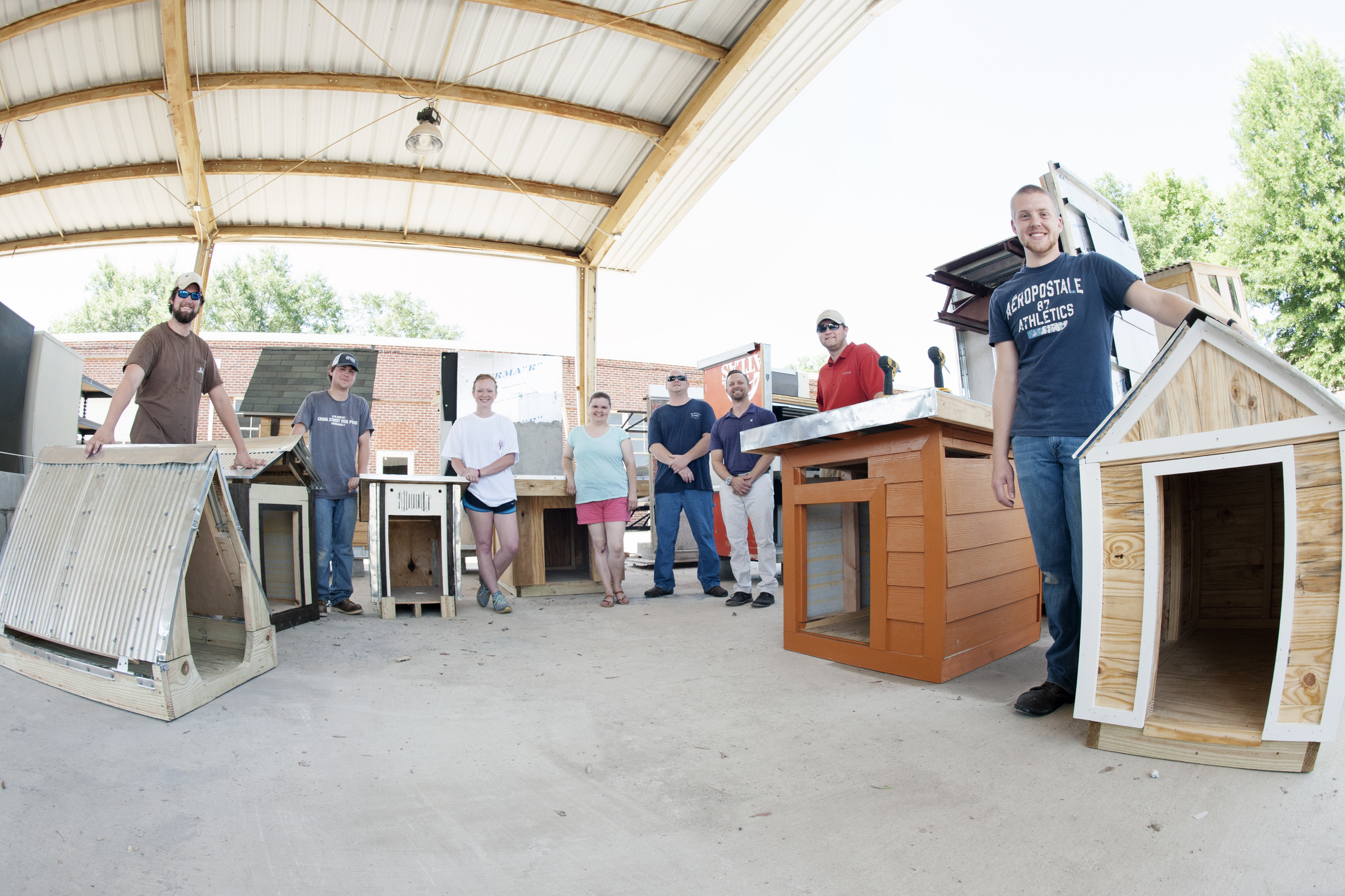 A class of MSU building construction science students recently custom built dog houses for Starkville-based Grassroots Animal Rescue of Mississippi Inc. They included (from left) Chipper Cary of Bolivar, Tennessee; Caleb Crenshaw of Union; and Regan Horn of Slidell, Louisiana; (second from right) Wesley Kerce of Jackson and Hunter Burcham of Glen. At center are GARM volunteers Jessica and Ryan Thompson and MSU building construction science assistant professor Tom Leathem. Class member Omar Ali of Madison is not pictured.