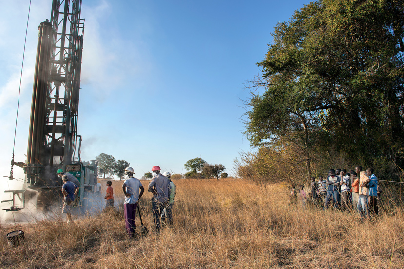 A crowd looks on as a well is built in rural Zambia during a previous MSU Engineers Without Borders trip. (Photo by Beth Wynn)