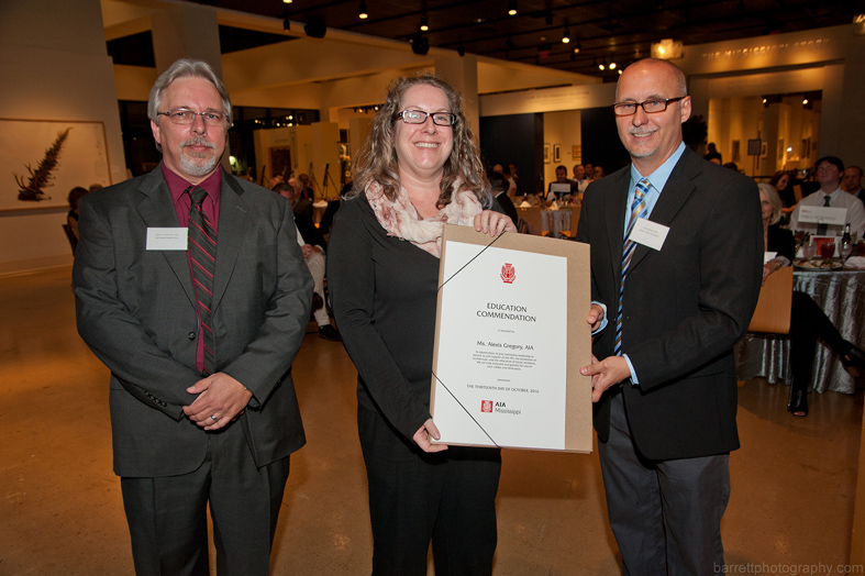 Mississippi State Associate Professor of Architecture Alexis Gregory, center, accepts an Education Commendation Membership Award from the American Institute of Architects’ Mississippi Chapter. AIA MS Secretary/Treasurer Brian Cabunac, left, and President John Beard presented the award on behalf of the organization. (Photo courtesy of BarrettPhotography.com)