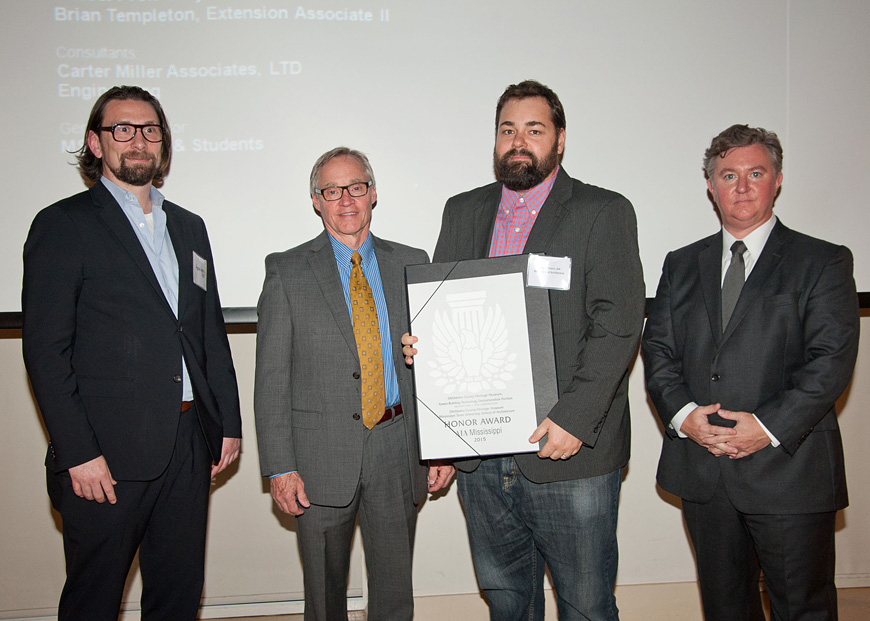 Mississippi State University recently was recognized by the state chapter of the American Institute of Architects for its role in implementing the Oktibbeha County Heritage Museum’s green technology demonstration pavilion. Pictured at AIAMS 2015 Mississippi Celebrates Architecture program are (l-r) lead juror Aaron Gentry, principal at tvsdesign in Atlanta, Georgia; Jim West, dean of MSU’s College of Architecture, Art and Design and chair of the AIAMS Design Awards; Hans C. Herrmann, MSU associate professor of architecture; and AIAMS President Brett Couples. (Photo courtesy of barrettphotography.com)