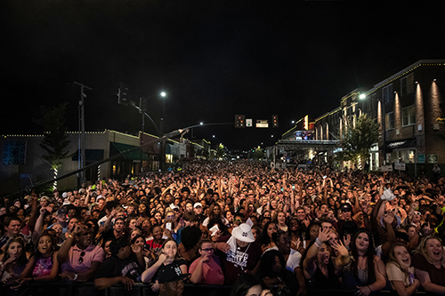 A large crowd is shown in downtown Starkville from the perspective of the stage during the 2019 Bulldog Bash.