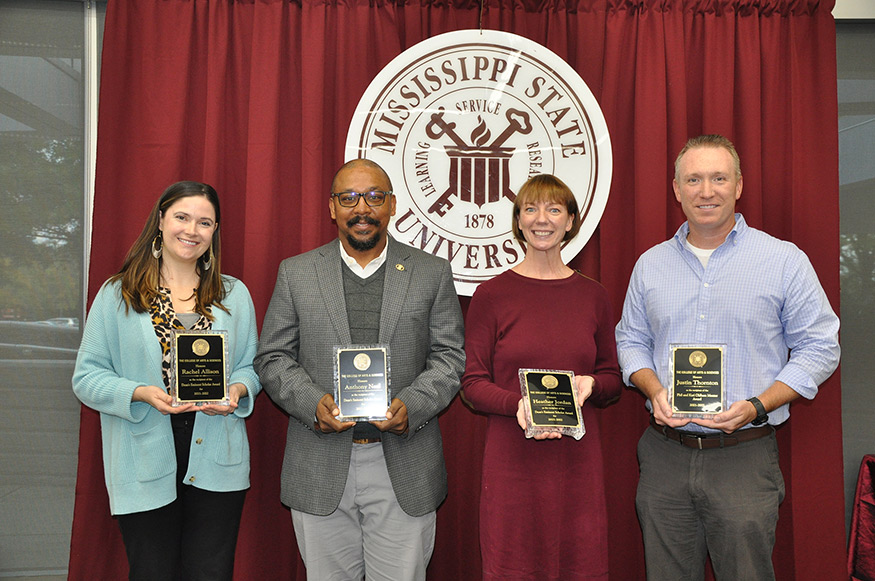 Pictured during a recent College of Arts and Sciences faculty meeting and awards ceremony are, from left, Rachel Allison, Anthony Neal, Heather Jordan and Justin Thornton. 