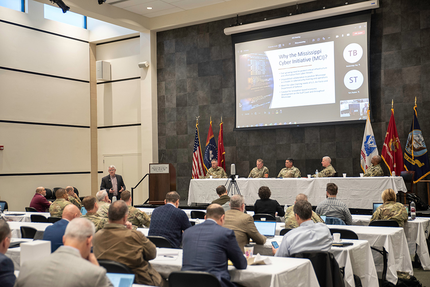 A wide shot of Jim Martin speaking during the Mississippi Cyber Initiative's Quarterly Cyber Summit