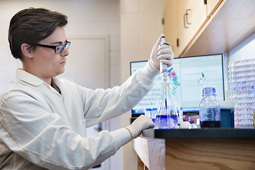 Lucas J. Ferguson of Batesville, MSU’s first Gates Cambridge Scholarship recipient and a 2017 magna cum laude biochemistry/bioinformatics bachelor’s graduate, now is pursuing his Ph.D. in immunology at University of California, Berkeley. He is pictured in a lab at MSU’s College of Veterinary Medicine, where as an undergraduate he collaborated with a team of researchers working to improve the system for developing life-saving flu vaccines. (Photo by Megan Bean)