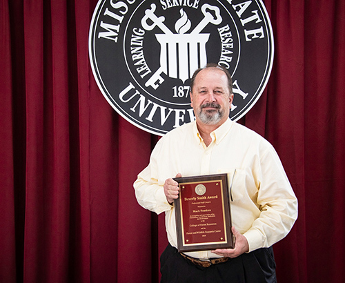 Mack Fondren holds the CFR/FWRC Beverly Smith Professional Staff Award