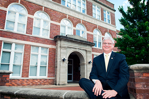 Robert Green pictured smiling in front of the McCain Engineering Building.