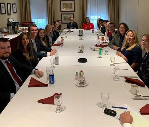 Congressman Guest (Left, end of table) and Congresswoman Slotkin (right, end of table) speak with students from Mississippi State University and Michigan State University