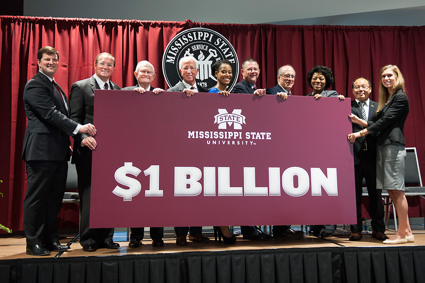 Mississippi State leaders inspired by the overwhelming response to “Infinite Impact,” the most successful fundraising campaign in university history, celebrated MSU President Mark E. Keenum’s announcement today [April 28] of a historic retargeting of the campaign with a fundraising goal of $1 billion by 2020. Joining in the announcement were (from left) John P. Rush, vice president of Development and Alumni; Keenum; Earnie Deavenport, chair of the MSU Foundation Board of Directors; Mickey Holliman, Bulldog Club president; Natalie Jones, Mississippi’s only 2016 Truman Scholar and Moore Presidential Scholar; Ron Black, National Alumni Association president; Cody Coyne, Faculty Senate president; Tamara Gibson, Staff Council chair; Henry Wan, associate professor and world-leading influenza researcher; and Roxanne Raven, Student Association president. (Photo by Russ Houston)