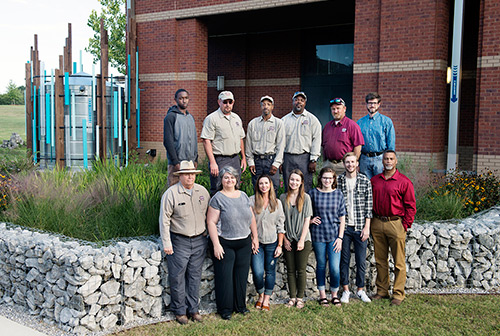 Facilities Management staff, faculty and students who helped build the award-winning raingarden include: (top, l-r): Timothy Johnson, Wade Ray, Douglas Dumas, Stanley Carpenter, Rodney Barksdale and Cory Gallo; (bottom, l-r): Joe Keeton, Suzanne Powney, Maddie Marascalco, Amy Farrar, Lauryn Rody, John-Taylor Corley and Tommy Verdell Jr. (Photo by Megan Bean)