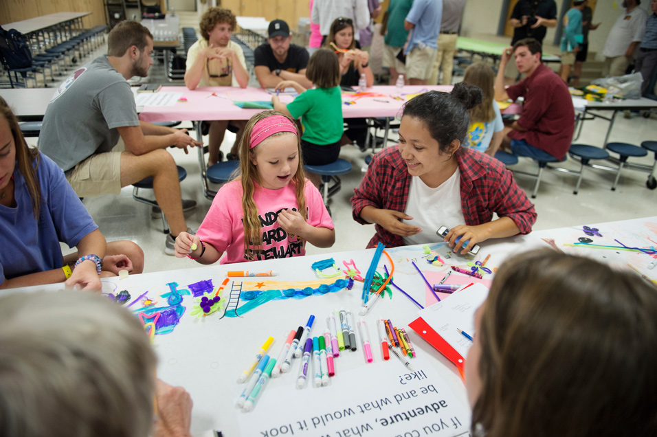 Aubree Burchfield, a third grader at Henderson Ward Stewart Elementary, brainstorms playground possibilities with MSU landscape architecture graduate student Eloisa De Leon. (Photo by Megan Bean)