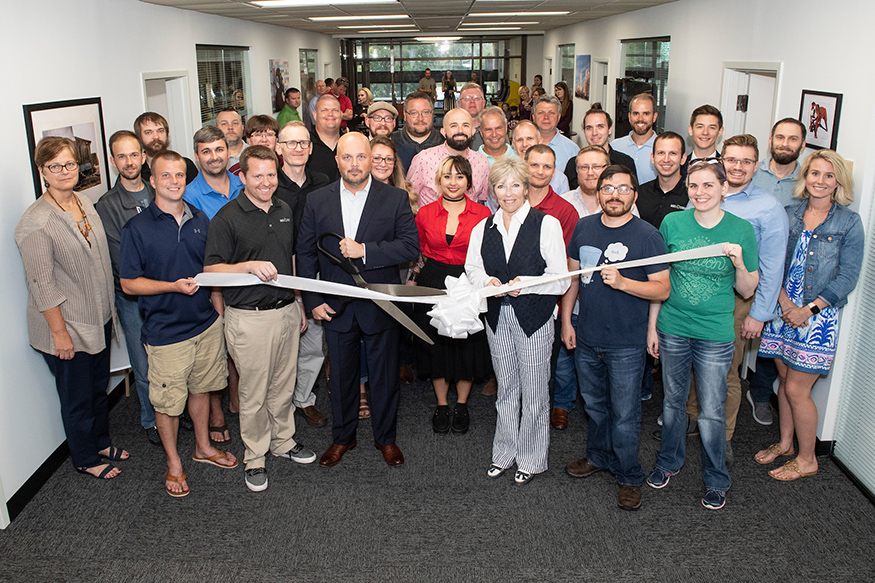 A large crowd gathers for the Babel Street ribbon cutting